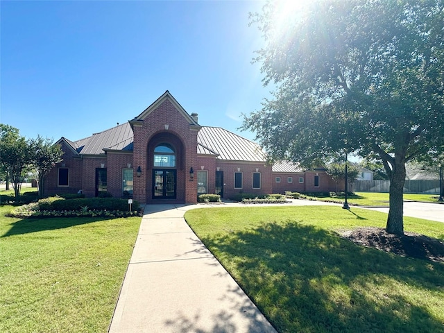 4407 Iron Creek Ct, Fresno, TX 77545 - view of front of property with a standing seam roof, a front yard, and metal roof