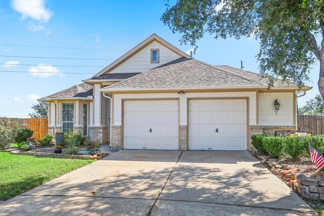 4407 Iron Creek Ct, Fresno, TX 77545 - traditional-style home with roof with shingles, fence, concrete driveway, a garage, and stone siding