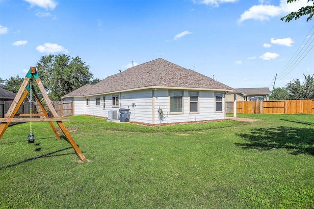 4407 Iron Creek Ct, Fresno, TX 77545 - back of property featuring cooling unit, a playground, and a shingled roof