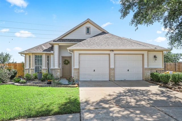 4407 Iron Creek Ct, Fresno, TX 77545 - view of front of house featuring a shingled roof, driveway, stone siding, and an attached garage