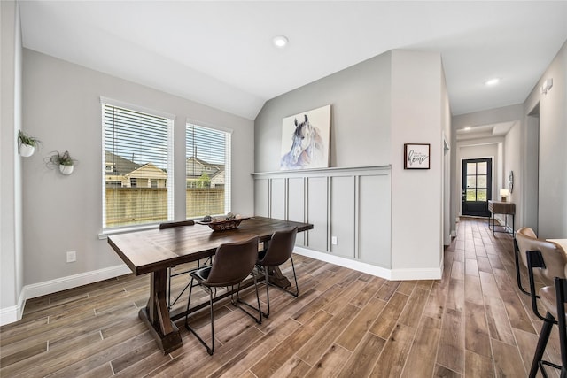 dining area featuring wood finished floors, baseboards, and recessed lighting