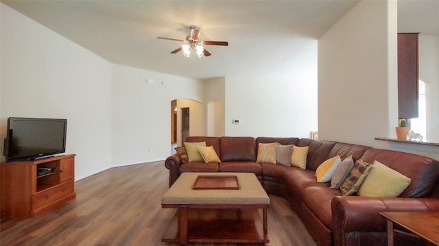 15407 Vincennes Oak St, Cypress, TX 77429 - living area with ceiling fan, arched walkways, and dark wood-type flooring