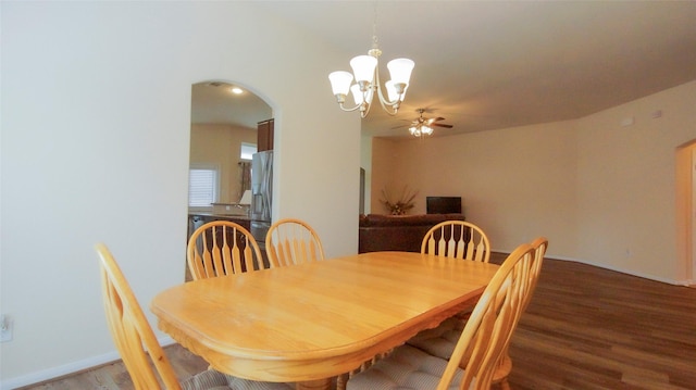 15407 Vincennes Oak St, Cypress, TX 77429 - dining space featuring wood finished floors, ceiling fan with notable chandelier, and arched walkways