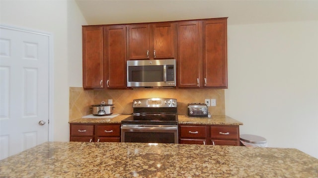 15407 Vincennes Oak St, Cypress, TX 77429 - kitchen with appliances with stainless steel finishes, decorative backsplash, and light stone counters