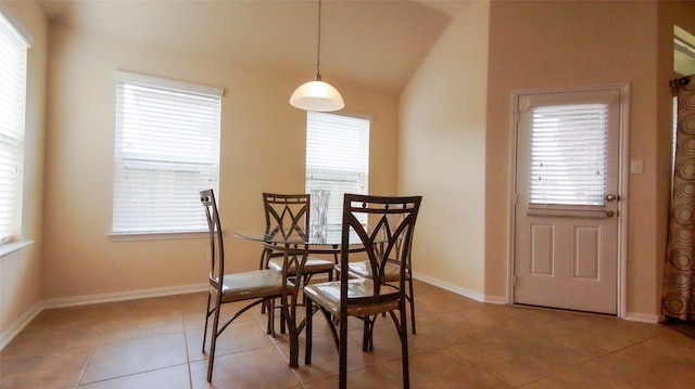 15407 Vincennes Oak St, Cypress, TX 77429 - tiled dining room featuring lofted ceiling and baseboards