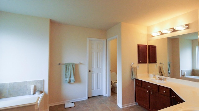 15407 Vincennes Oak St, Cypress, TX 77429 - full bathroom featuring toilet, a garden tub, and baseboards