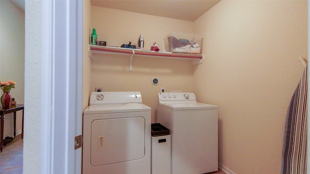 15407 Vincennes Oak St, Cypress, TX 77429 - laundry room featuring washer and clothes dryer, laundry area, and light tile patterned floors