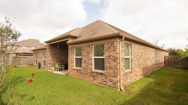 15407 Vincennes Oak St, Cypress, TX 77429 - rear view of property with a lawn, a patio area, brick siding, and a fenced backyard
