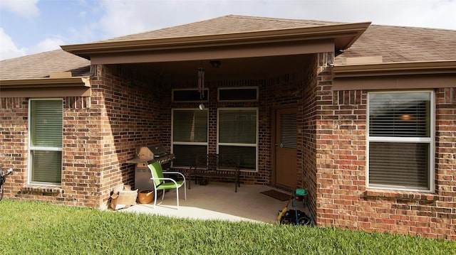 15407 Vincennes Oak St, Cypress, TX 77429 - back of house with roof with shingles, a patio, and brick siding