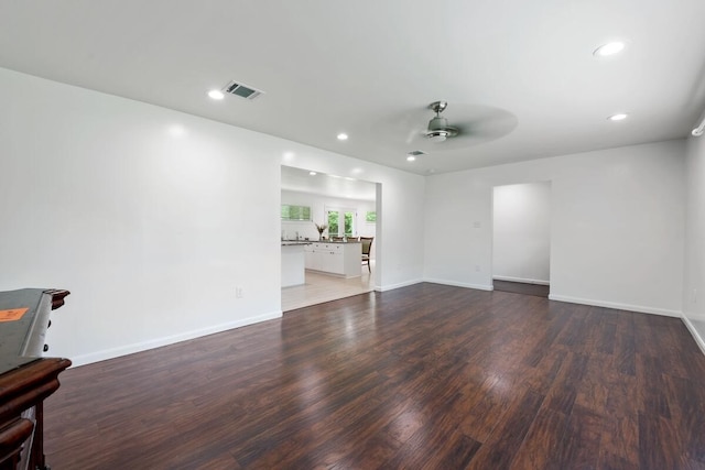 unfurnished room with ceiling fan, recessed lighting, visible vents, and wood finished floors