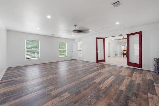 unfurnished room with attic access, wood finished floors, ceiling fan, and recessed lighting