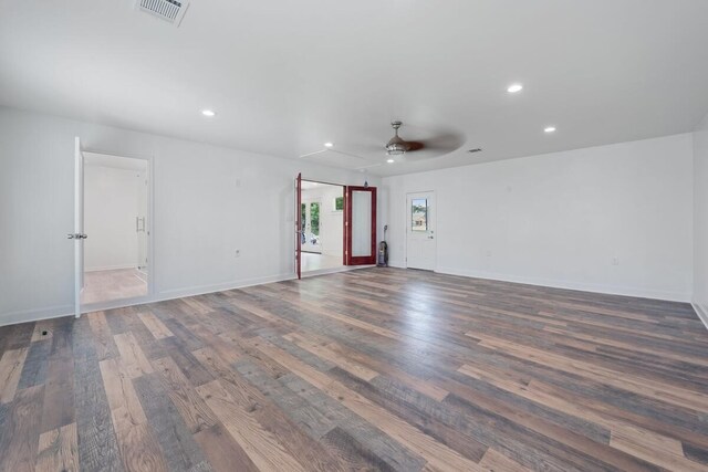 unfurnished living room featuring ceiling fan, wood finished floors, visible vents, and recessed lighting