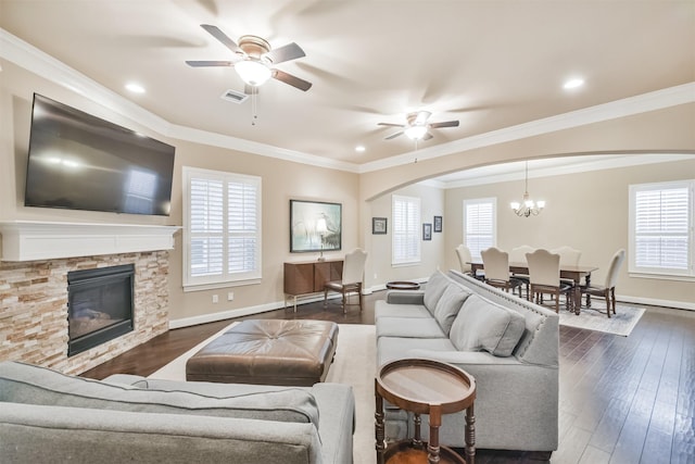11002 Upland Forest Dr, Houston, TX 77043 - living area featuring dark wood-style flooring, ceiling fan with notable chandelier, arched walkways, and baseboards