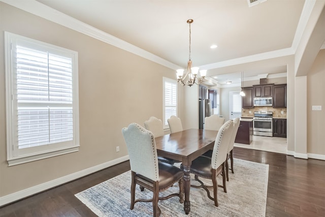 11002 Upland Forest Dr, Houston, TX 77043 - dining space featuring a notable chandelier, recessed lighting, baseboards, ornamental molding, and dark wood-type flooring