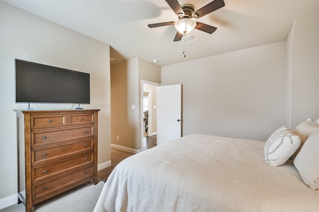 11002 Upland Forest Dr, Houston, TX 77043 - carpeted bedroom with visible vents, baseboards, and ceiling fan