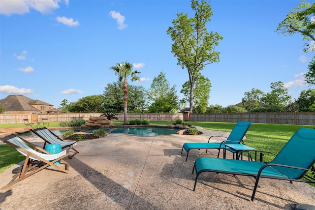 view of swimming pool with a fenced backyard, a patio, and a lawn