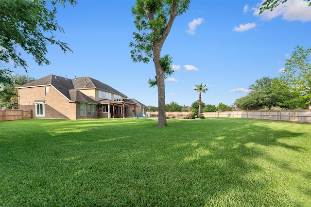 view of yard with a fenced backyard