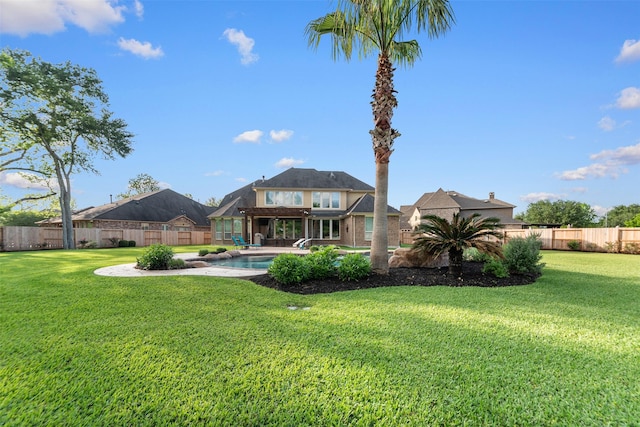 view of yard featuring a patio, a fenced in pool, and a fenced backyard