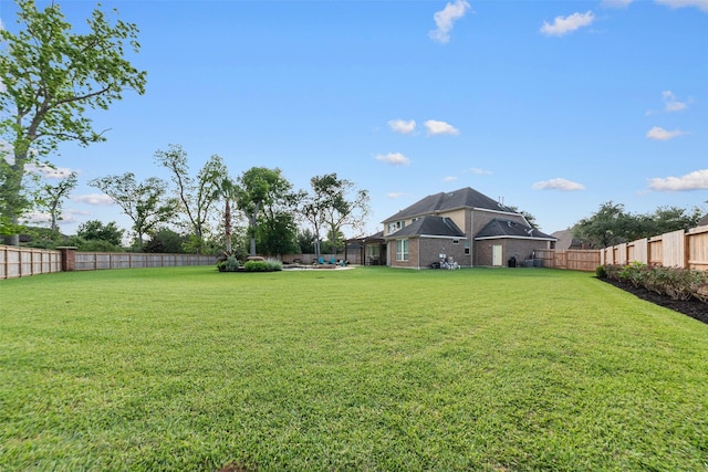 view of yard featuring a fenced backyard
