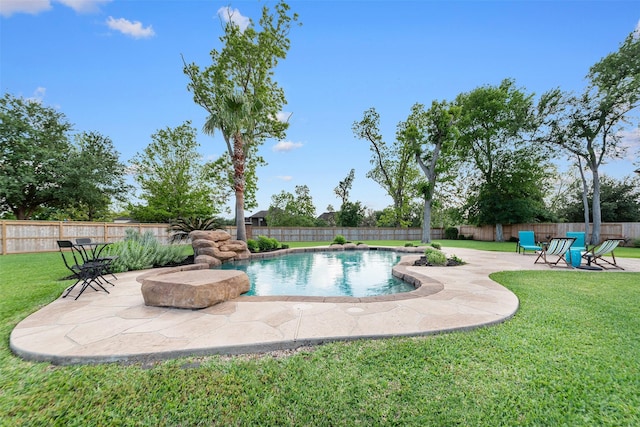 view of pool featuring a lawn, a patio area, a fenced in pool, and a fenced backyard