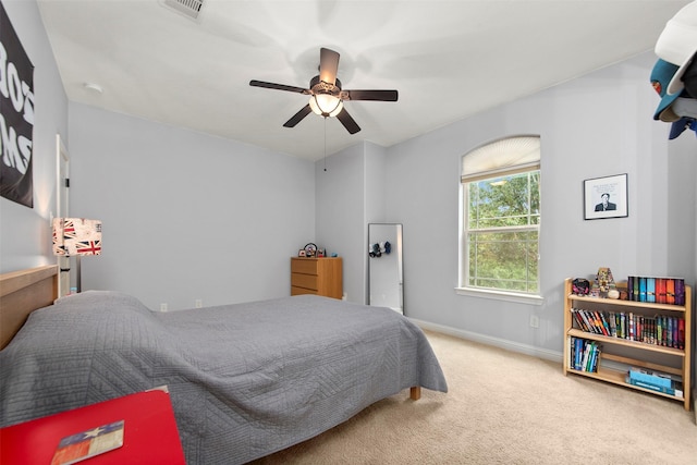 carpeted bedroom featuring ceiling fan, baseboards, and visible vents
