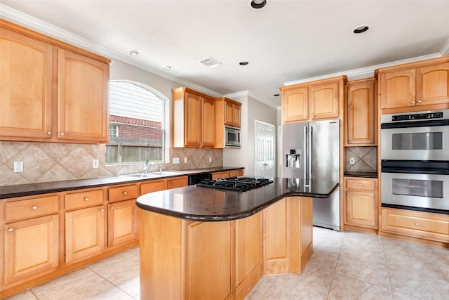 kitchen with a sink, ornamental molding, light tile patterned floors, a kitchen island, and appliances with stainless steel finishes
