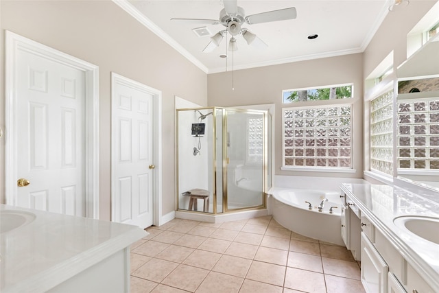 bathroom featuring vanity, crown molding, tile patterned flooring, a shower stall, and a garden tub
