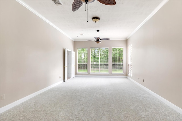 unfurnished room featuring ornamental molding, visible vents, ceiling fan, and carpet