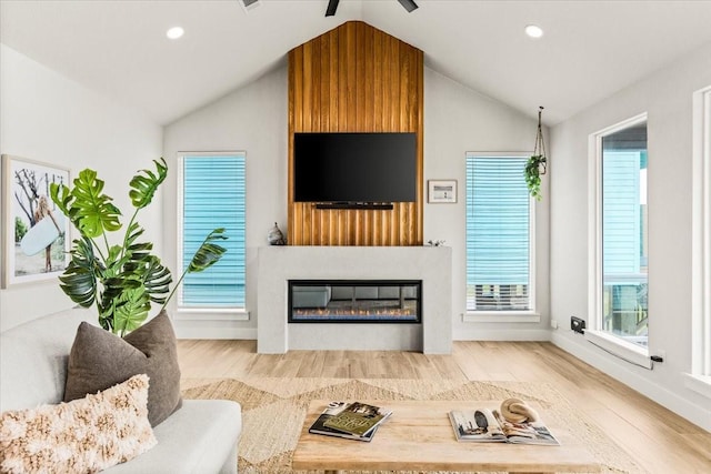 living room with vaulted ceiling, wood finished floors, baseboards, and recessed lighting
