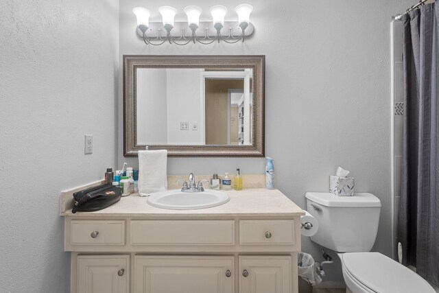 6180 Afton Ln, Beaumont, TX 77706 - full bath with toilet, vanity, and a chandelier