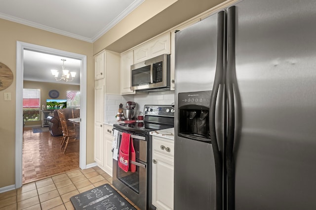 6180 Afton Ln, Beaumont, TX 77706 - kitchen with white cabinetry, stainless steel appliances, a chandelier, and crown molding
