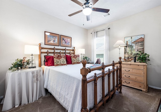 carpeted bedroom featuring visible vents and a ceiling fan