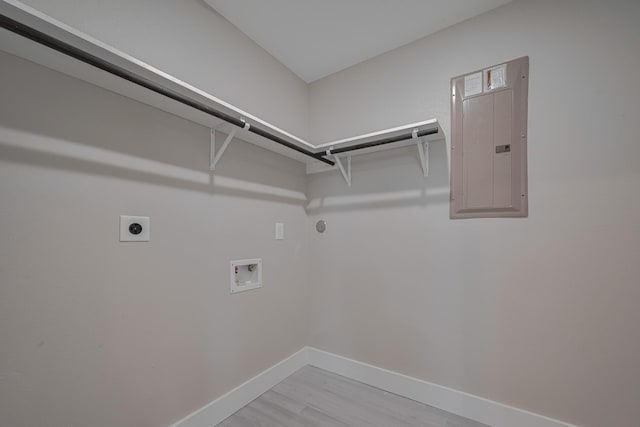laundry room with electric dryer hookup, laundry area, washer hookup, electric panel, and baseboards