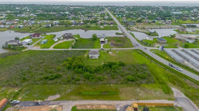 birds eye view of property with a water view and a residential view