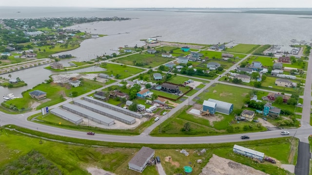 drone / aerial view with a water view and a residential view