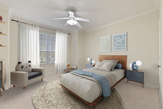 bedroom featuring ornamental molding, light carpet, baseboards, and a ceiling fan
