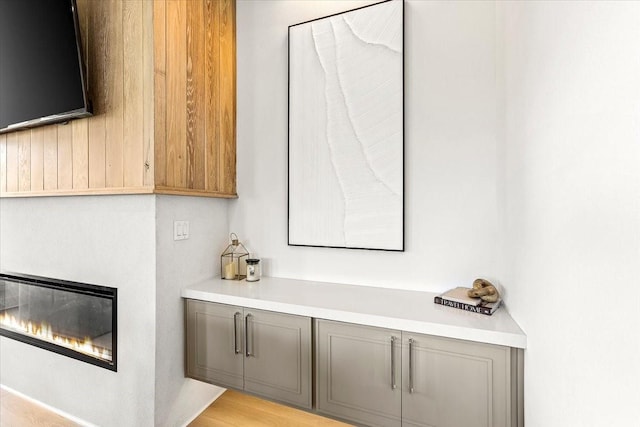 bar with a glass covered fireplace