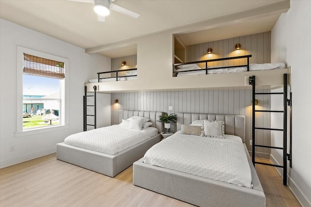 bedroom with baseboards and wood finished floors