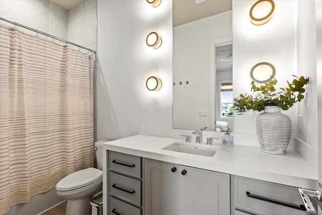 full bath featuring curtained shower, vanity, and toilet