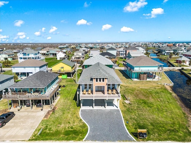 birds eye view of property with a residential view