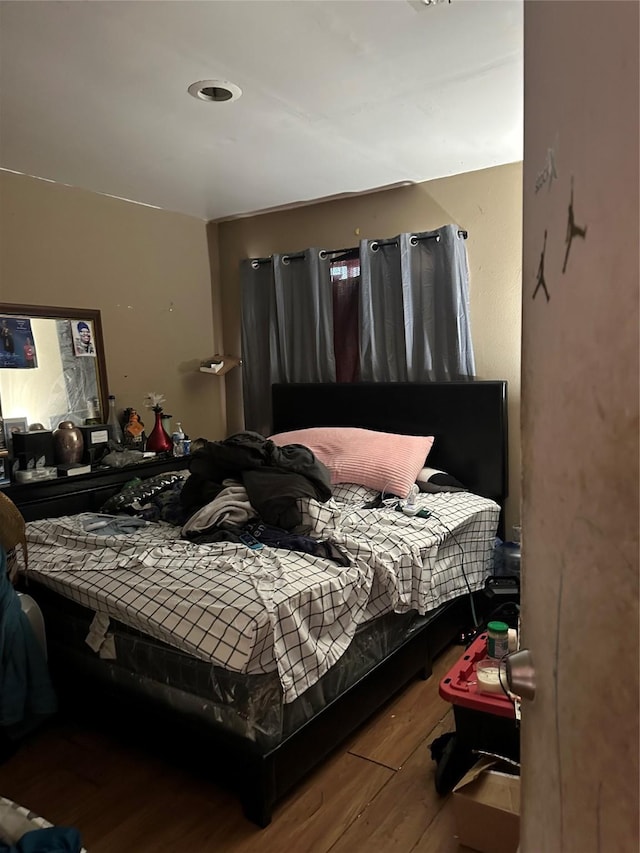 bedroom with wood finished floors