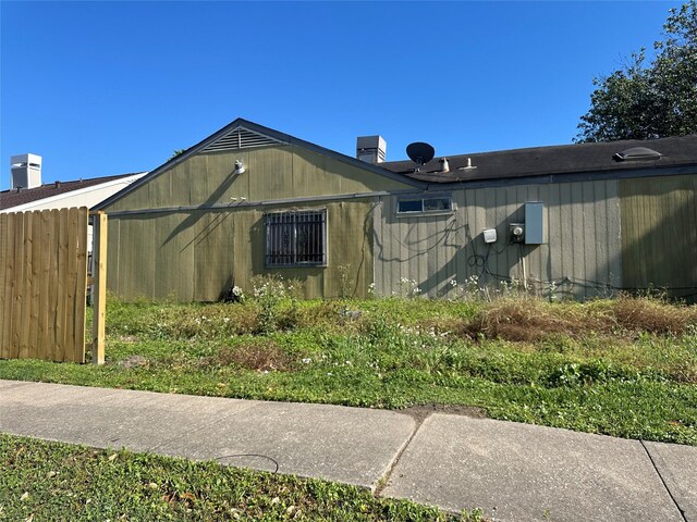 view of side of property with fence