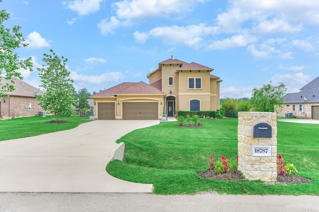 18787 Serene Water Dr, Montgomery, TX 77356 - mediterranean / spanish house featuring concrete driveway, an attached garage, stucco siding, and a front yard