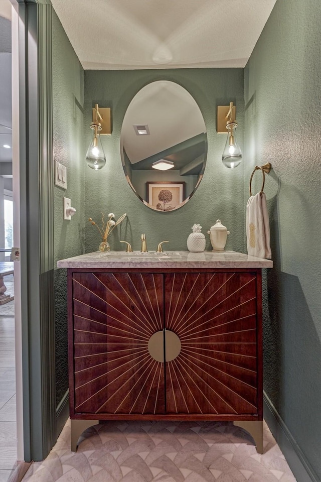 18787 Serene Water Dr, Montgomery, TX 77356 - bathroom featuring baseboards, vanity, and a textured wall