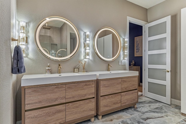 18787 Serene Water Dr, Montgomery, TX 77356 - full bathroom featuring marble finish floor, vanity, and a textured wall