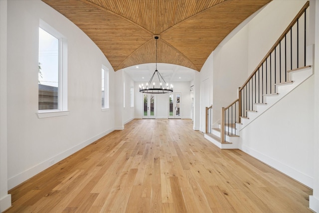 519 W 27th St, Houston, TX 77008 - entrance foyer with a notable chandelier, wooden ceiling, baseboards, stairs, and hardwood / wood-style flooring