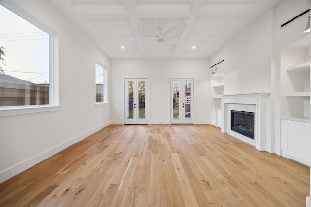 519 W 27th St, Houston, TX 77008 - unfurnished living room featuring french doors, baseboards, light wood finished floors, ceiling fan, and a fireplace