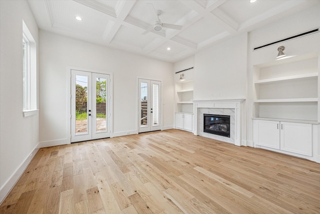 519 W 27th St, Houston, TX 77008 - unfurnished living room with light wood-style floors, baseboards, beamed ceiling, and recessed lighting