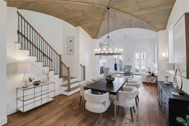 519 W 27th St, Houston, TX 77008 - dining area with stairway, dark wood finished floors, an inviting chandelier, and recessed lighting