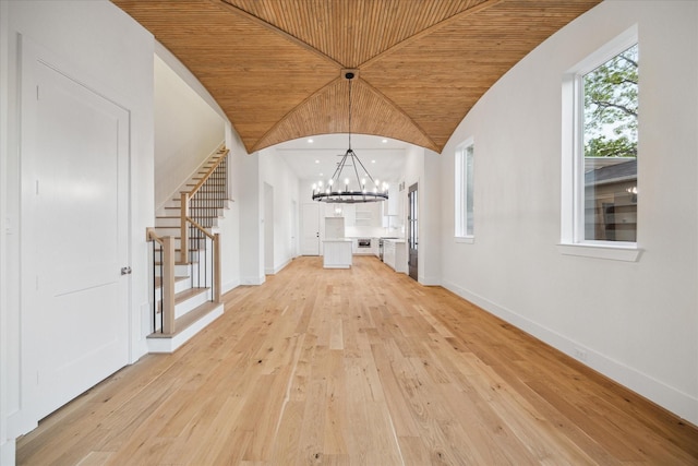 519 W 27th St, Houston, TX 77008 - unfurnished dining area featuring wooden ceiling, an inviting chandelier, stairs, and baseboards